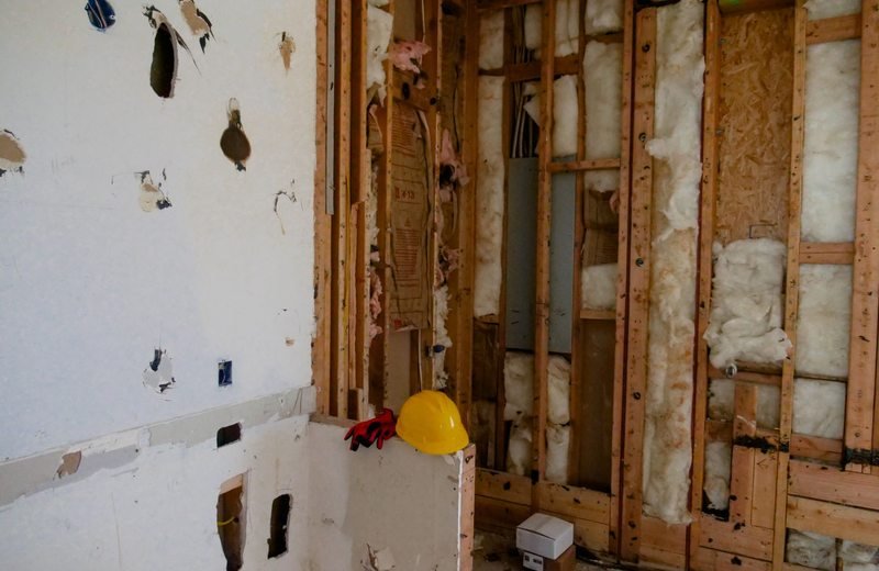 Exposed wall framing in an interior renovation space